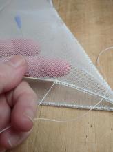 Obšití lana na spodním dílu sítě v lovícím otvoru